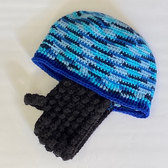 Crocheted beanie with beard.